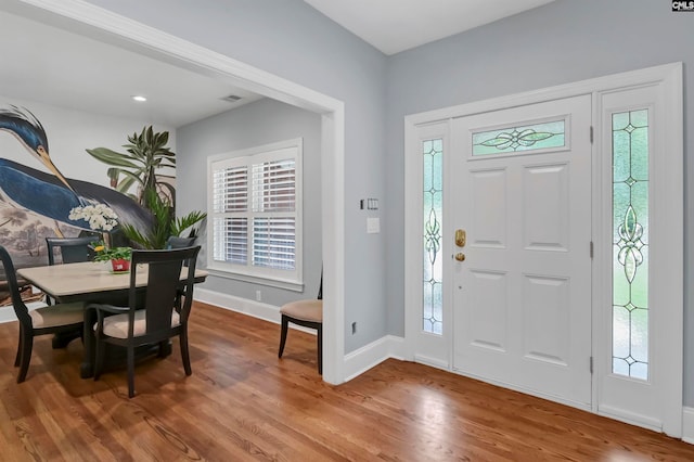 entryway with plenty of natural light and wood-type flooring