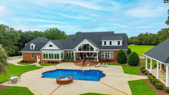 view of pool with a patio area and a jacuzzi