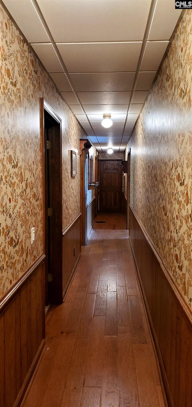 corridor with dark hardwood / wood-style floors