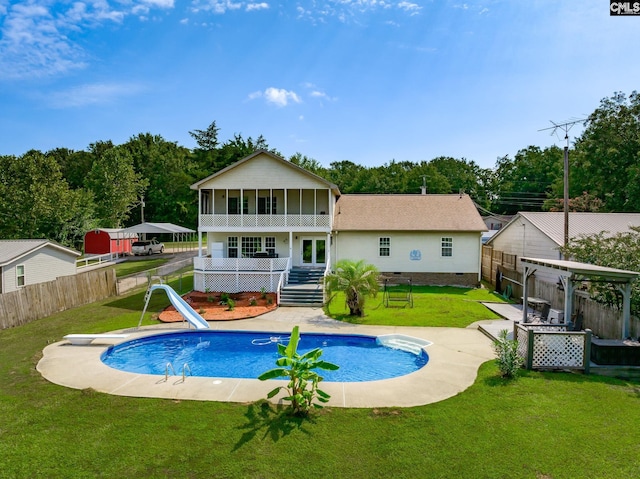 rear view of property featuring a fenced backyard, a lawn, crawl space, a fenced in pool, and a pergola