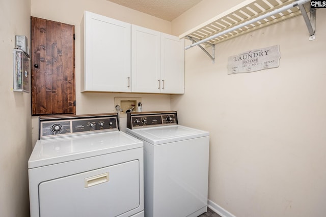 laundry area featuring cabinet space, baseboards, and washer and dryer