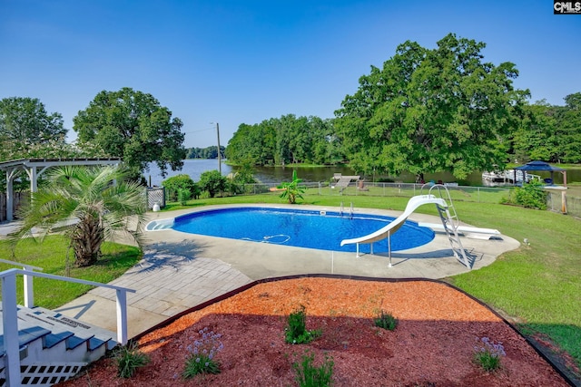 view of swimming pool featuring a fenced in pool, a water slide, a water view, and a yard