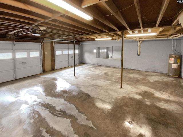 garage with a garage door opener and water heater