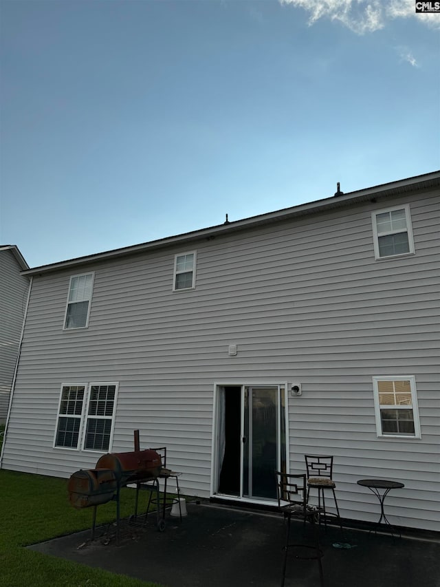 rear view of house featuring a patio area