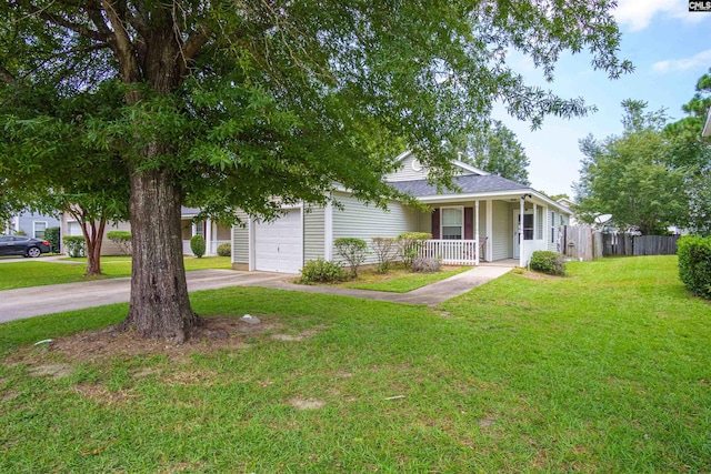 view of front of house featuring a garage and a front lawn