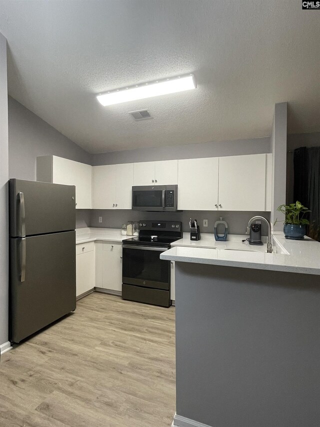 dining area featuring light wood-type flooring