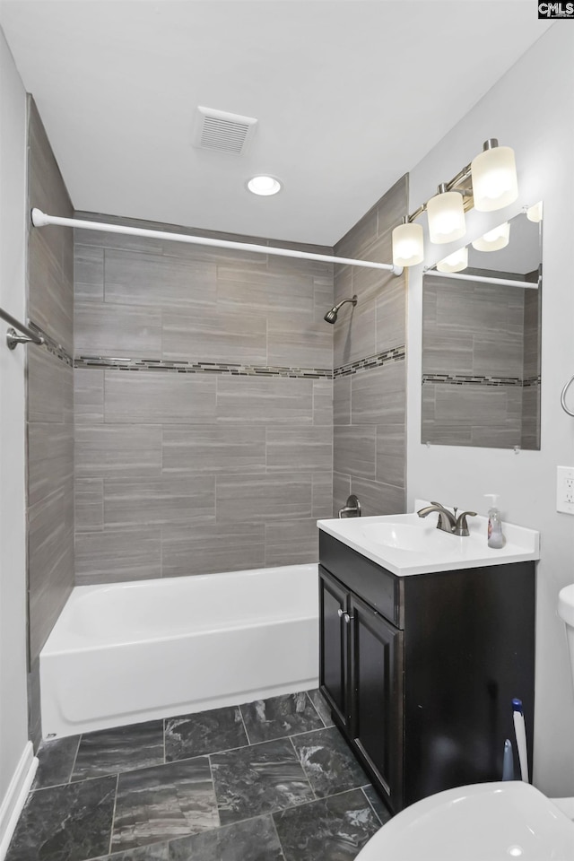 bathroom featuring visible vents, shower / washtub combination, toilet, marble finish floor, and vanity