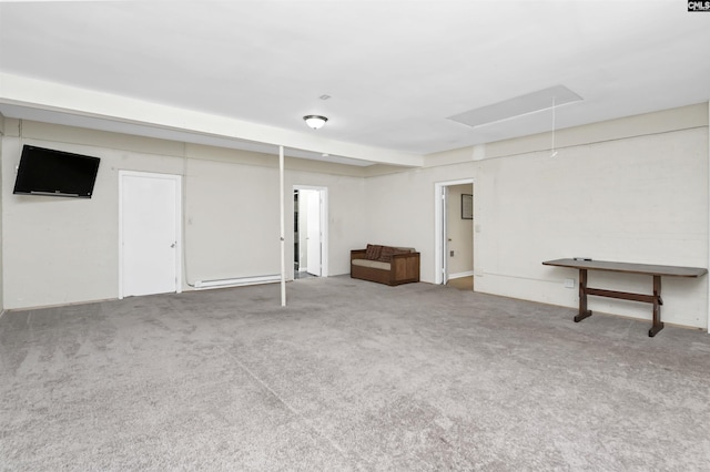 basement with carpet flooring and baseboard heating