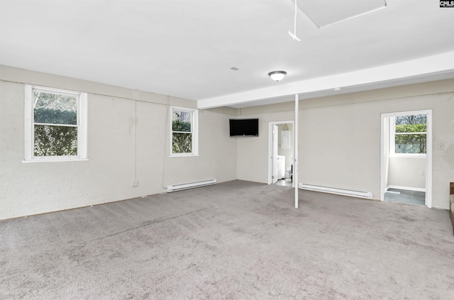 interior space with a baseboard heating unit and carpet floors