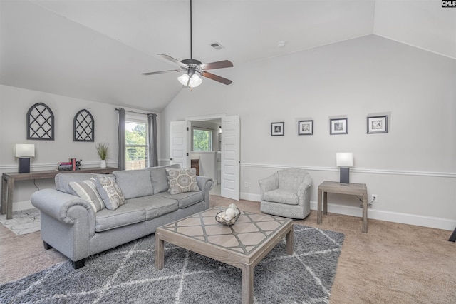 carpeted living room featuring lofted ceiling, baseboards, visible vents, and a ceiling fan