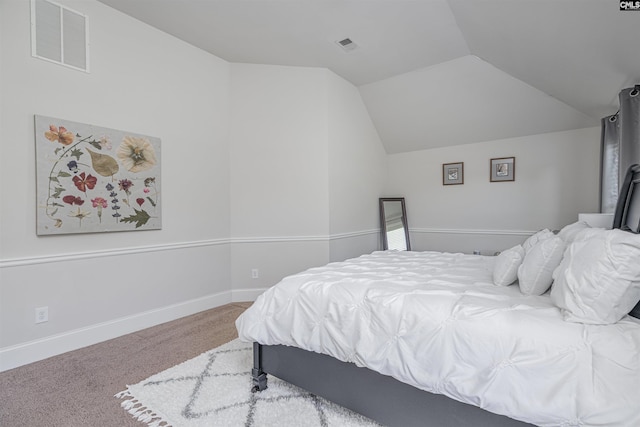 bedroom featuring lofted ceiling, baseboards, visible vents, and carpet