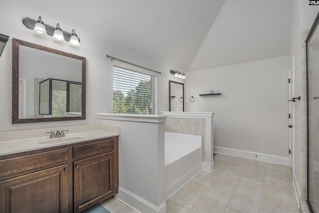 full bathroom with lofted ceiling, a garden tub, vanity, baseboards, and a stall shower