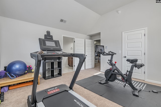 workout room with light colored carpet, visible vents, vaulted ceiling, and baseboards