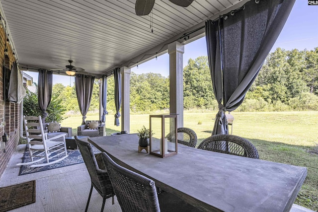 view of patio featuring a ceiling fan and outdoor dining area