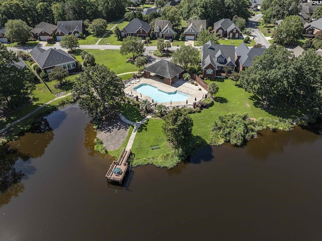 birds eye view of property featuring a water view and a residential view