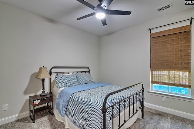 bedroom featuring ceiling fan and carpet