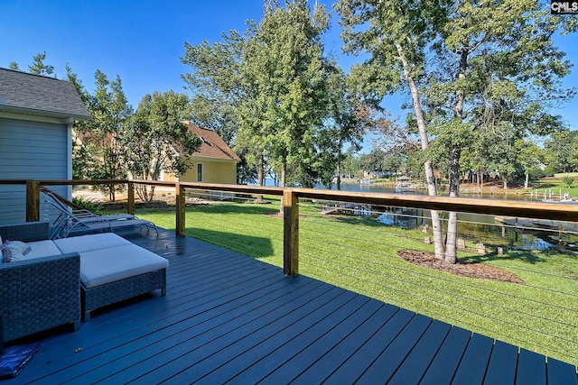 wooden deck featuring a yard, a water view, and an outdoor hangout area