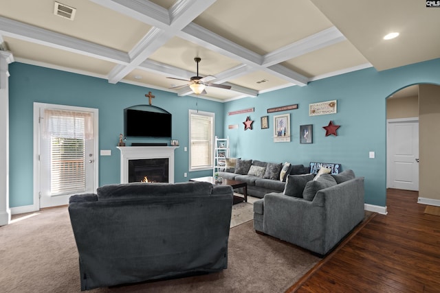 living room with ceiling fan, coffered ceiling, dark hardwood / wood-style floors, and beam ceiling