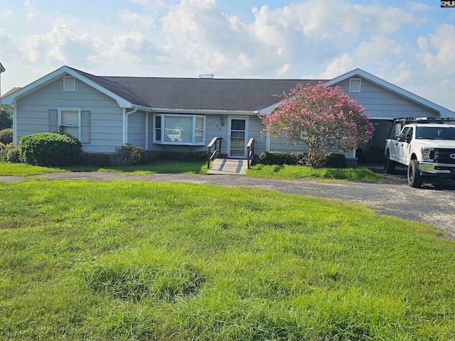 ranch-style home with a front yard