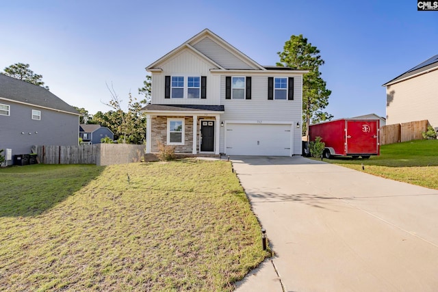 view of front of house featuring a front lawn, a shed, and a garage