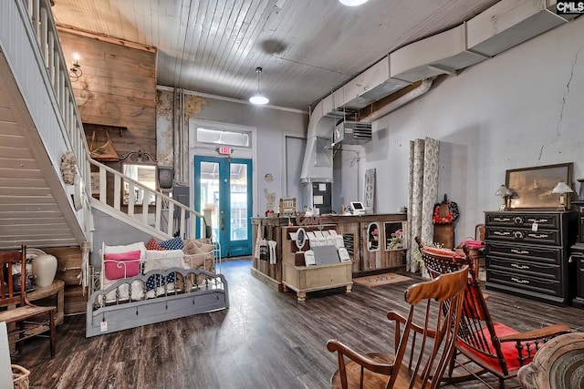 interior space featuring wood walls, french doors, and dark hardwood / wood-style flooring