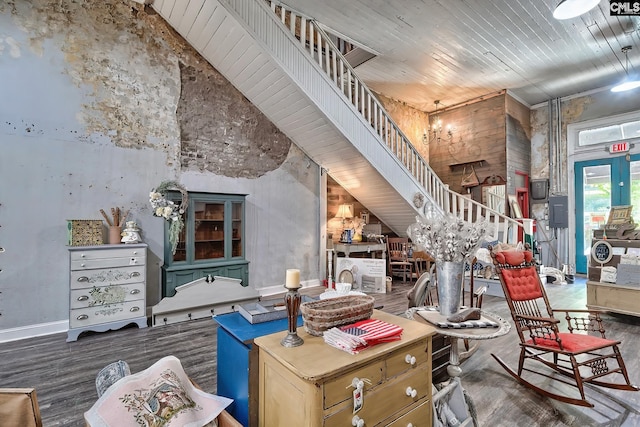 misc room with hardwood / wood-style floors, a high ceiling, and wooden ceiling