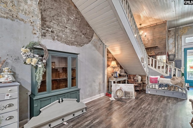 interior space with high vaulted ceiling, dark wood-type flooring, and wood ceiling