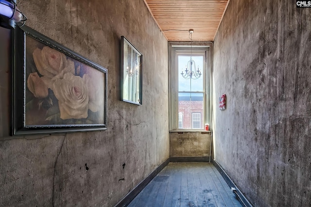 interior space featuring wood ceiling, a notable chandelier, and hardwood / wood-style floors