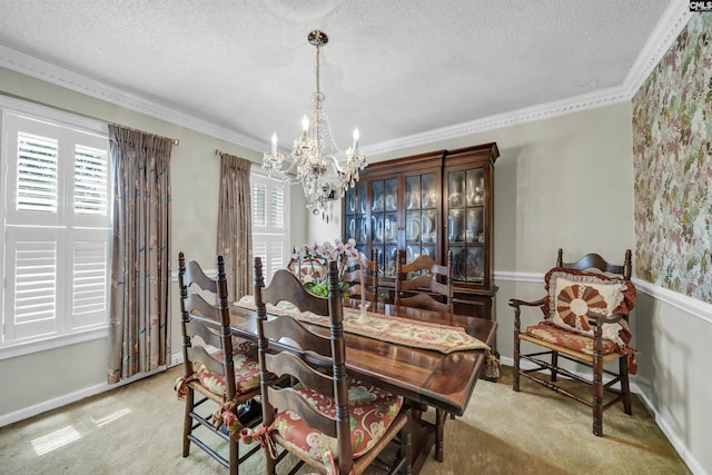 dining room with a notable chandelier, plenty of natural light, light carpet, and a textured ceiling