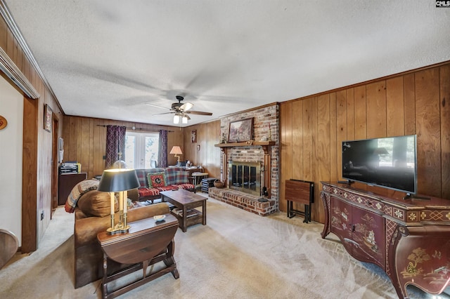 living area featuring french doors, wood walls, a brick fireplace, and light colored carpet