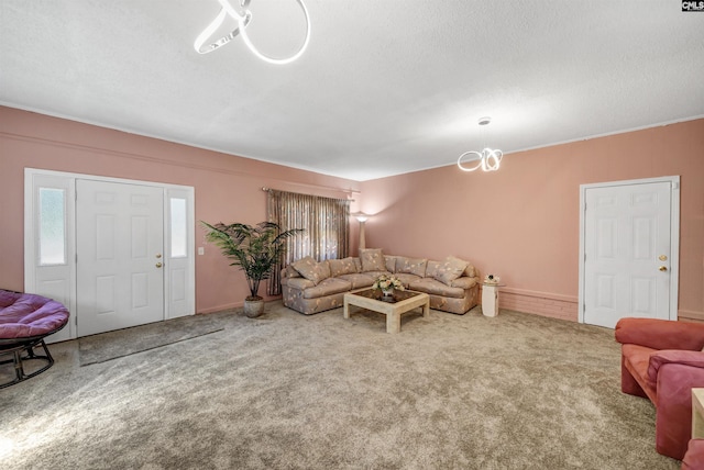 carpeted living area with a textured ceiling and a chandelier