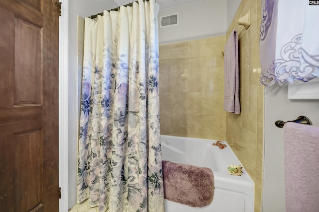 full bathroom featuring shower / bath combo and visible vents