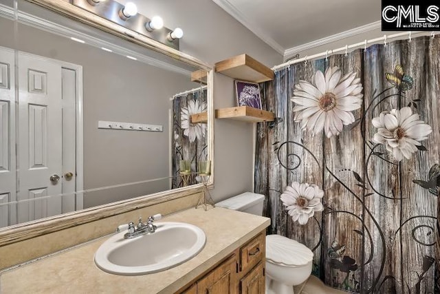 bathroom featuring crown molding, vanity, and toilet