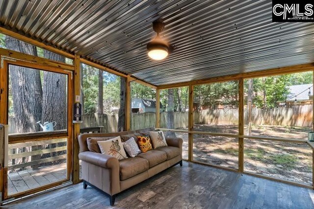 sunroom / solarium featuring a healthy amount of sunlight