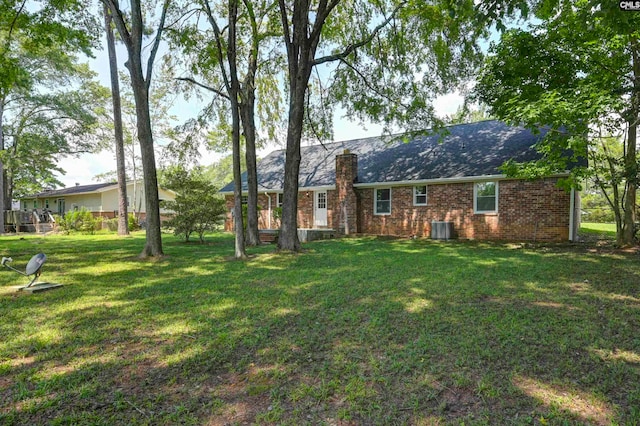 exterior space with a yard and cooling unit