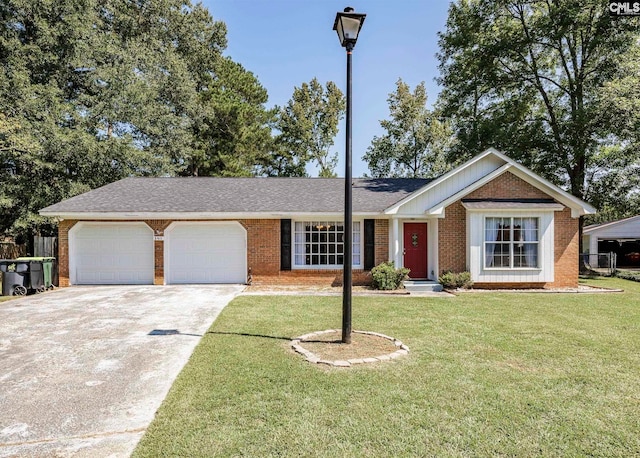 ranch-style house with a garage and a front yard