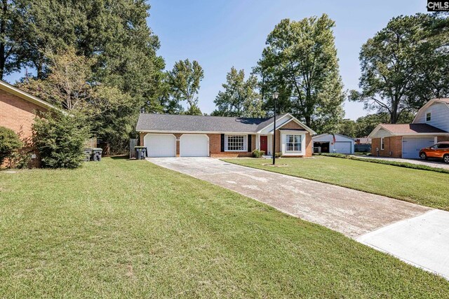 single story home featuring a front lawn and a garage