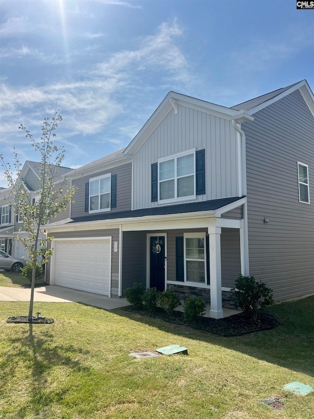 view of front facade with a front yard and a garage