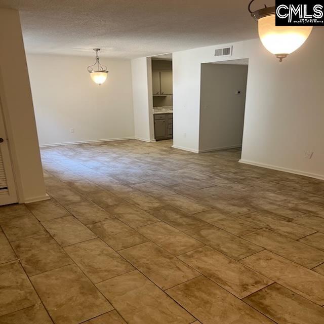 1208 Bush River Rd Unit F-7, Columbia, SC 29210 - spare room featuring baseboards