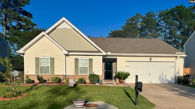 view of front facade with a garage and a front lawn