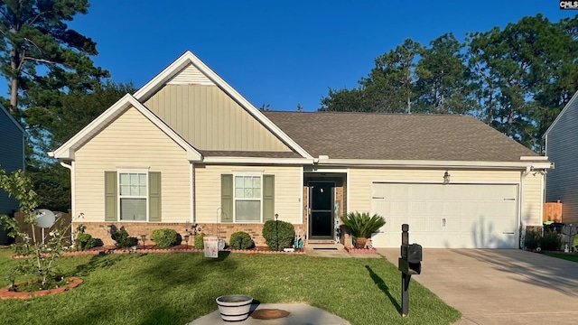 craftsman-style home with a garage, brick siding, concrete driveway, and a front yard