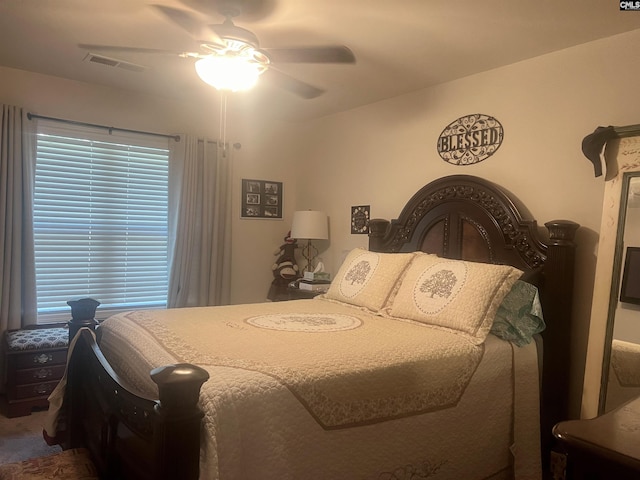 bedroom with visible vents and a ceiling fan