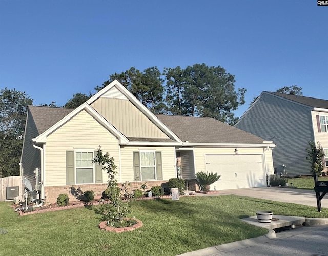 view of front of property featuring driveway, an attached garage, a front yard, board and batten siding, and brick siding