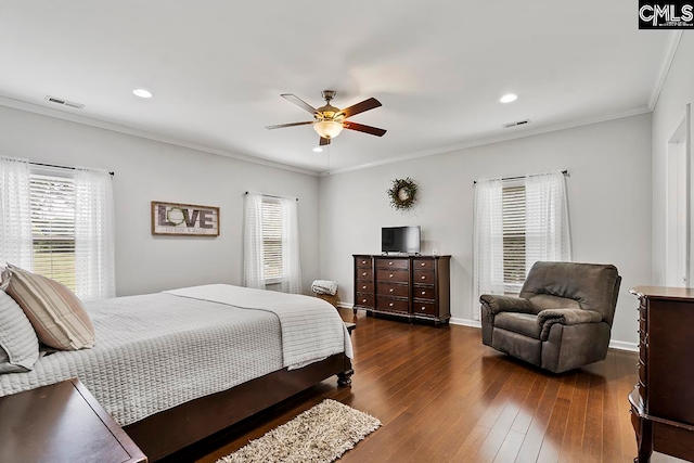 bedroom with multiple windows, ornamental molding, dark wood-type flooring, and ceiling fan