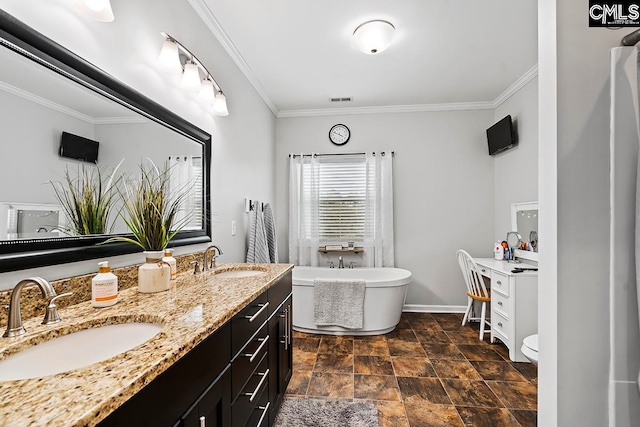 bathroom with a washtub, vanity, crown molding, tile patterned floors, and toilet