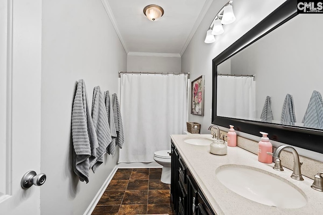 bathroom with tile patterned flooring, toilet, crown molding, and vanity