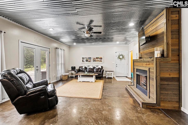 living room featuring ceiling fan and french doors