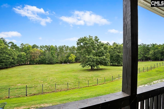 view of yard with a rural view