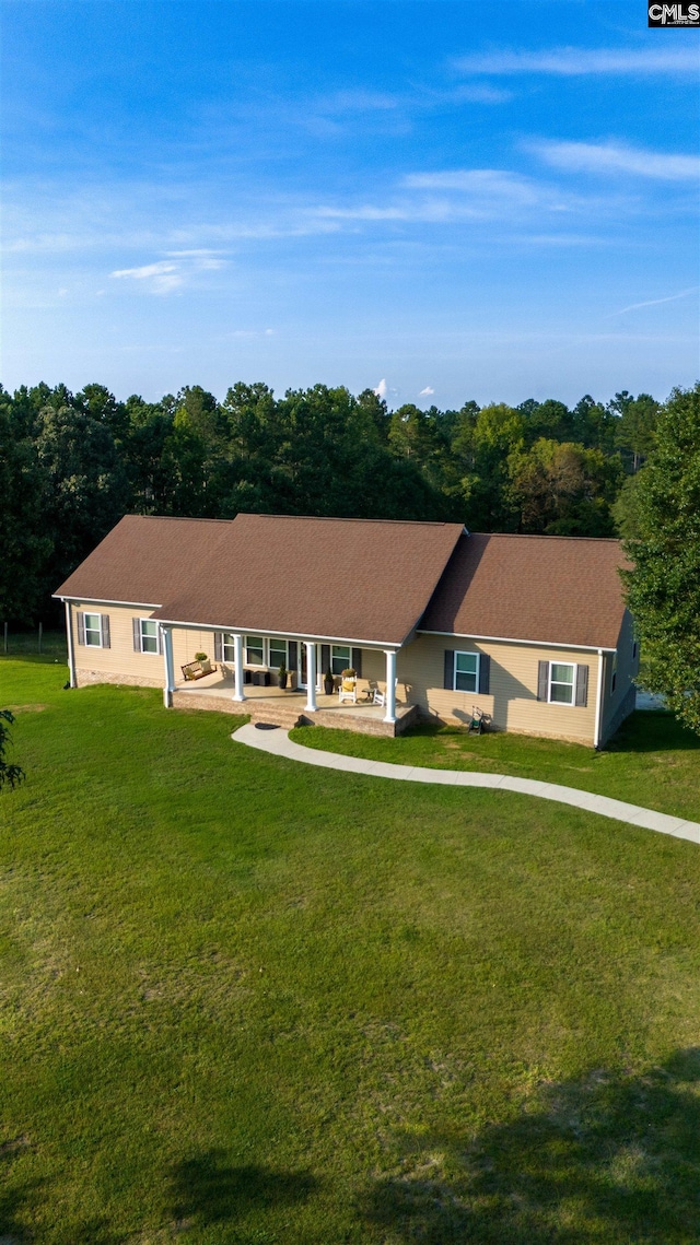 single story home featuring a front yard