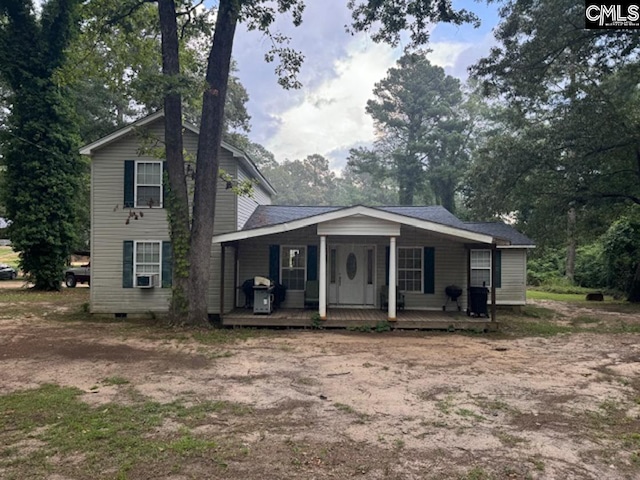 view of front of house featuring cooling unit and covered porch